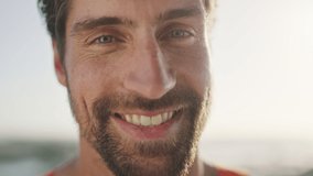 Face, travel and happy with man in adventure mockup, outdoor and smile with natural light and vacation, freedom and traveling. Portrait, happiness and peace with calm against blurred background. - Powered by Shutterstock - Get 15% off with code: PIKWIZARD15