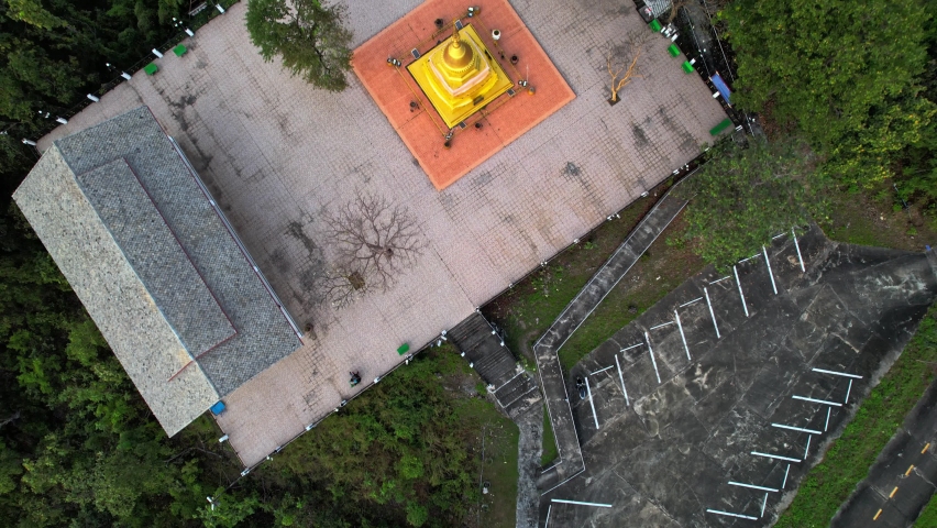 High angle view of the pagoda on the top of the mountain. surrounded by mountains and many trees.
