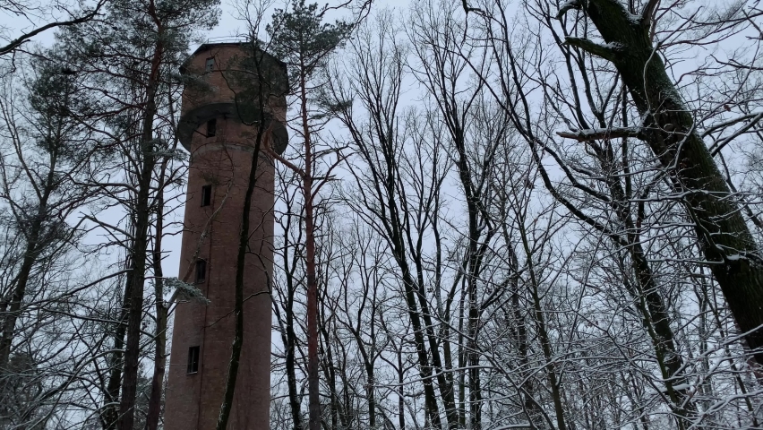 Winter, snow, forest. Abandoned soviet building. Old brick building decaying. 