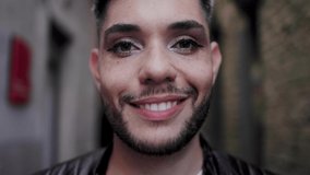 Gay transgender person wearing makeup smiling outdoor - LGBTQ nonbinary concept - Powered by Shutterstock - Get 15% off with code: PIKWIZARD15