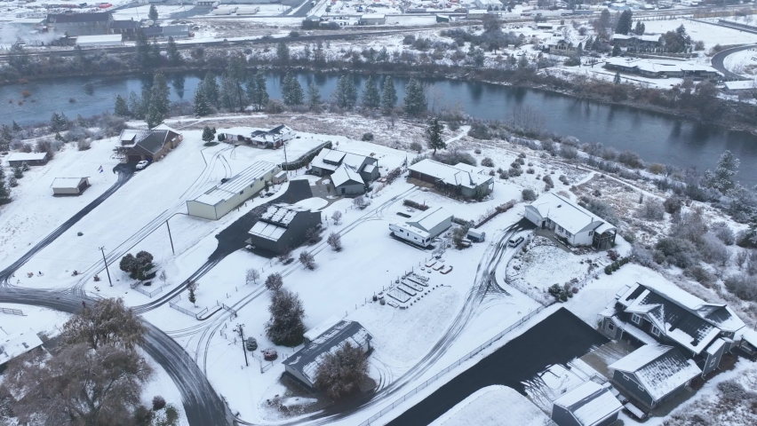 Aerial view of wealthy properties lining the Spokane River during winter time.