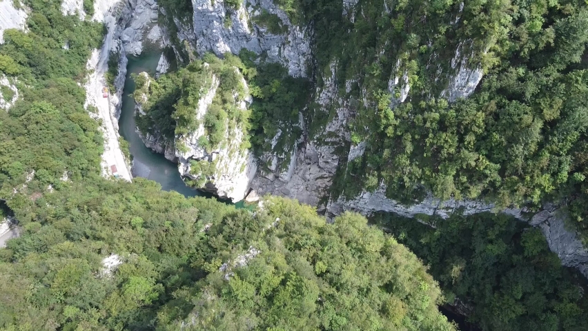 Majestic river in deep rocky canyon, aerial drone view Royalty-Free Stock Footage #1097699809
