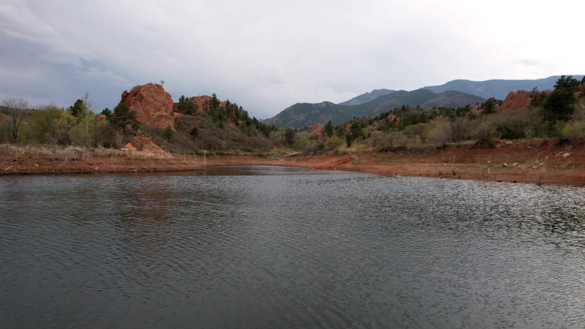 Flying Over Lake River Water Surface at Red Rock Canyon Colorado, Panoramic Aerial View of Wild Valley in Park With Beautiful Landscape Surroundings and Mountains in Horizon 