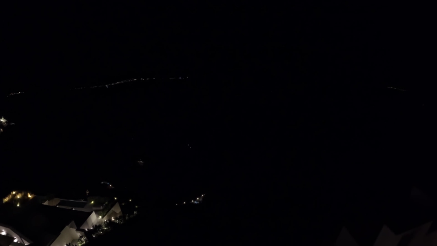 Timelapse of sunrise over Santorini Bay with cruise ships arriving into the bay and many other small boat activity filmed over 12 hours. Night to Day, Facing West