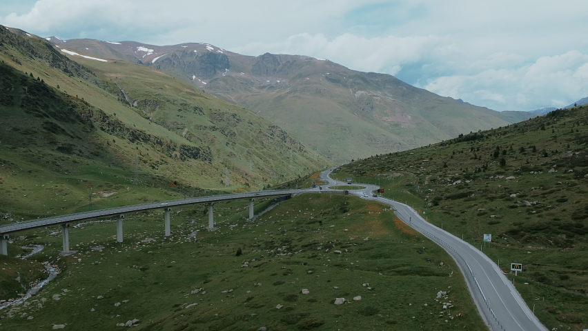 Traffic Across The Bridge With Roundabout Road Junction Near El Pas de la Casa Town In Andorra. Aerial Shot