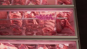 Vertical Screen: Beef steaks in dry aged meat aging in refrigerating cabinet. Dry aging meat in cold storage. Dry-aged cuts of raw meat, aged beef for steaks. - Powered by Shutterstock - Get 15% off with code: PIKWIZARD15