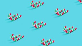 Loopable video of candy canes on pastel blue background 4k.