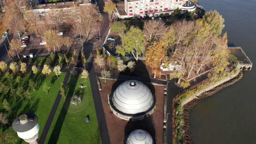 Topdown Of Gas Holders And Water Tower At The Mallegat Park In Rotterdam, Netherlands. aerial pan left Royalty-Free Stock Footage #1097715619