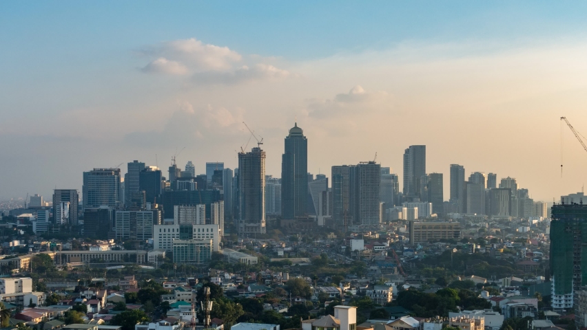 [4K UHD Time lapse video] Philippines Manila BGC Skyscrapers from Day to Night Magic hour (zoom out) Royalty-Free Stock Footage #1097716125