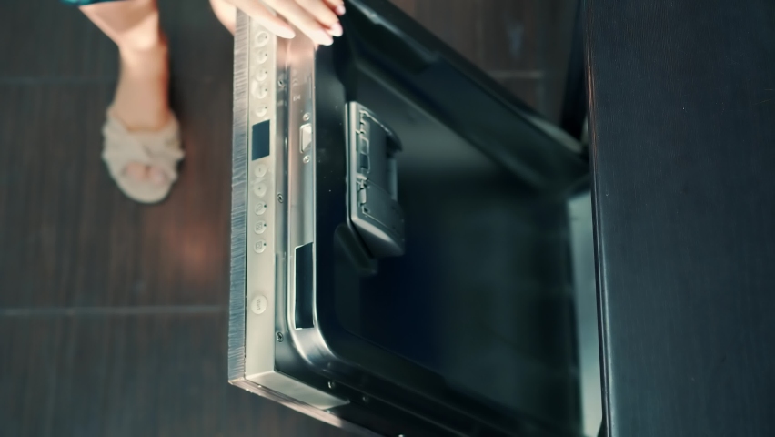 Puts Dirty Dishes In Dishwasher Machine. Everyday Housework With Utensil Dishes In Kitchen. Housewife Use Modern Appliance Keep Clean Kitchen. Loading Dirty Plates Kitchenware And Glass In Dishwasher | Shutterstock HD Video #1097717105