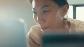 Close-up Happy smiling Asian girl university with white cream pajamas lay down on fluffy comfort bed use credit card online shopping successful payment on digital tablet in morning on bedroom at home. - Powered by Shutterstock - Get 15% off with code: PIKWIZARD15