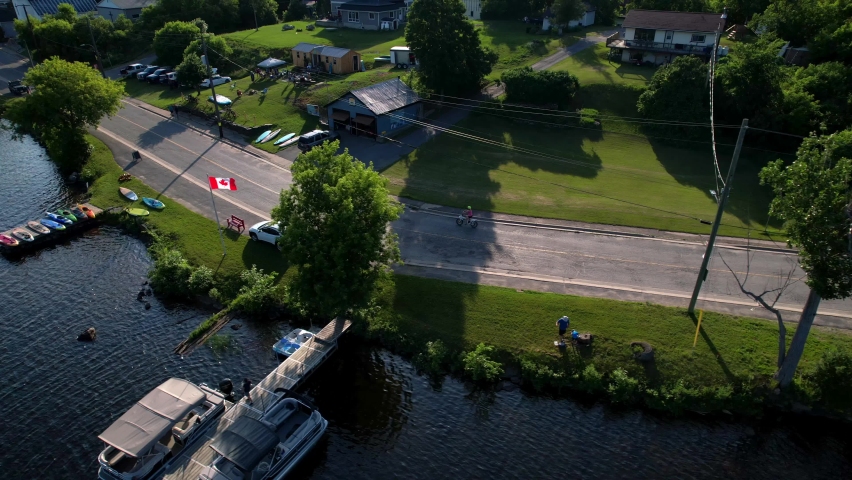 e-bikes riding along river edge at golden hours