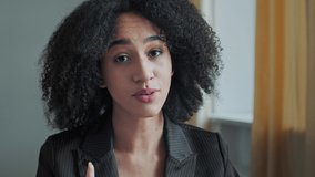Cute african woman with trendy curly hair record speech at camera online webinar talk business advice to internet audience businesswoman make virtual job interview in video chat modern tech blogging