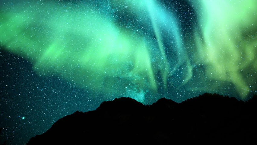 Aurora Glowing Green and Milky Way Galaxy Mountains Loop | Shutterstock HD Video #1097745999