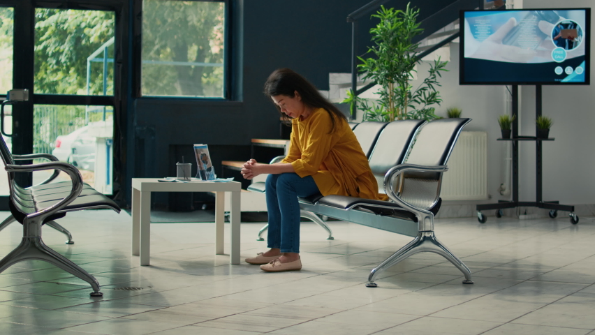 Old patient attending checkup appointment with nurse at health center, waiting in hospital lobby to receive treatment. Doing consultation and medical examination to cure illness.
