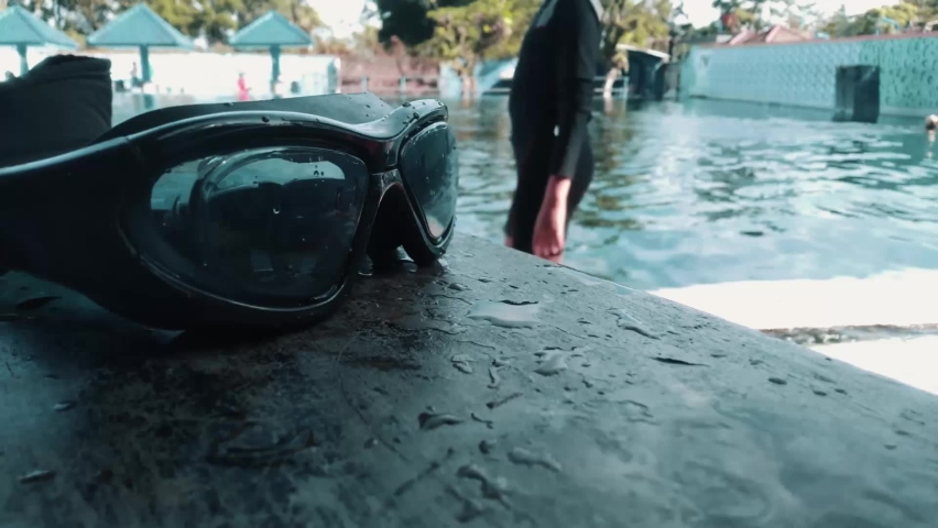 swimming goggles and activities in the swimming pool in the morning