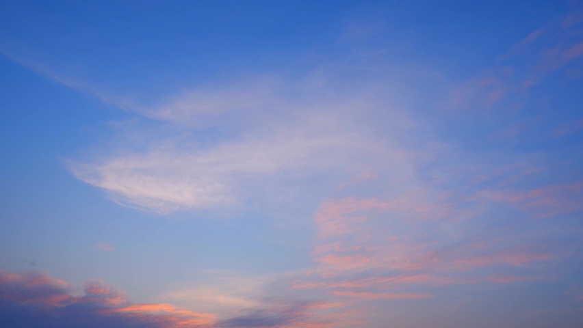 4K : Timelapse video : Beautiful colorful clouds in the sunset sky. loop of clouds background. winter sky. sky from the plane window. clouds at sunset. natural motion background. weather concept
