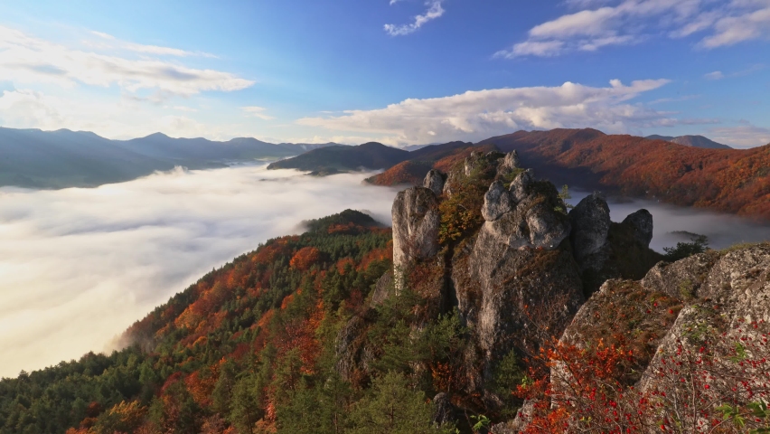 Scenic view of autumn mountain landscape with foggy valley. The Sulov Rocks, national nature reserve in northwest of Slovakia, Europe. Timelapse footage.