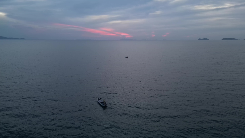 Boat in the ocean at sunset time in Thailand