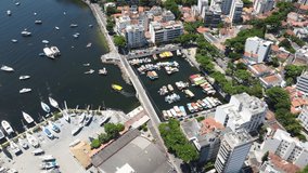 Aerial video of Urca neighborhood and iconic Sugarloaf Mountain in Rio de Janeiro, Brazil