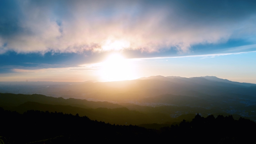 Enjoy a romantic colorful sunset from the top of the mountain. Blue sky orange evening sunset. Wufen Mountain, Ruifang District, New Taipei City, Taiwan
