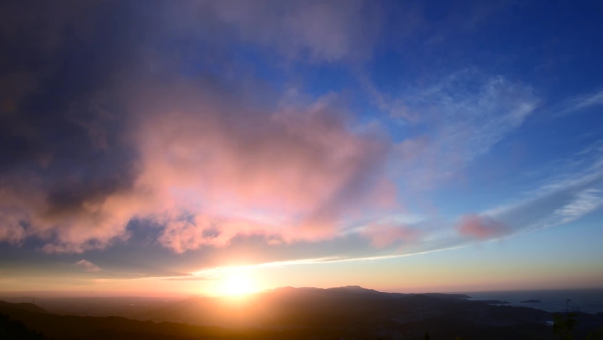 Enjoy a romantic colorful sunset from the top of the mountain. Blue sky orange evening sunset. Wufen Mountain, Ruifang District, New Taipei City, Taiwan
