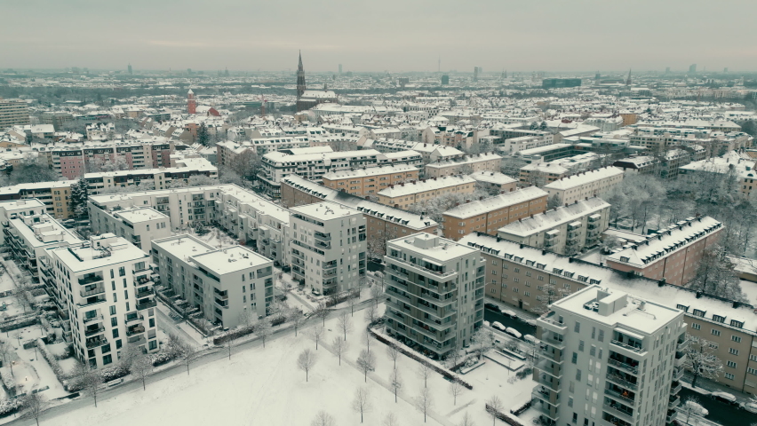 Munich aerial skyline view drone footage at winter snow downtwon munich germany winter district giesing munchen bavaria. Royalty-Free Stock Footage #1097782489