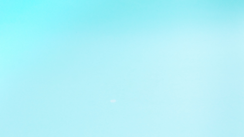 4k Pancakes appear one after another on a white plate, forming a stack. Then the pancakes disappear. Delicious food concept. Stop motion animation. Turquoise background.