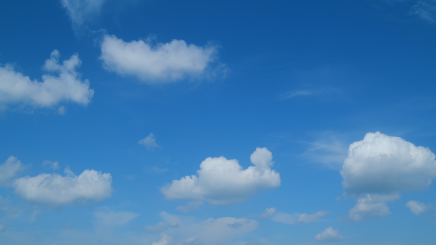 Sky with bautiful silky clouds. Puffy fluffy cumulus and cirrus on different layers clouds. Timelapse.