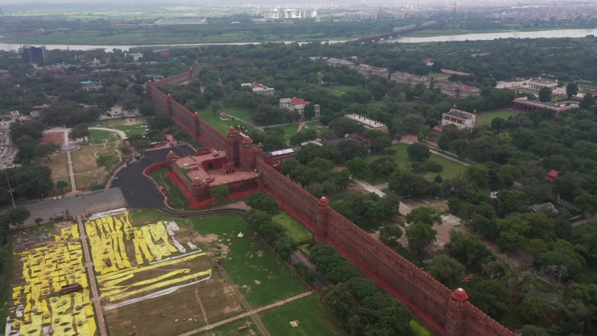 An aerial shot from the top of the Red Fort, Lal Qila with the Indian flag in New Delhi, India
 Royalty-Free Stock Footage #1097815817