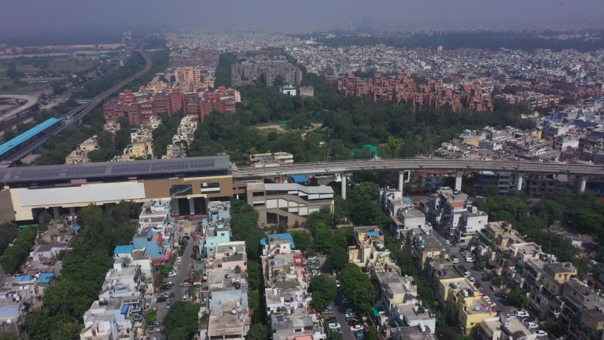 An aerial shot of the Delhi metro entering the station at Mayur Vihar,New Delhi, India
