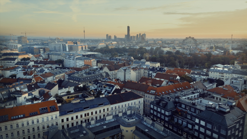 Aerial View of Vienna Asutria Giant Ferris Wheel in Vienna, Austria. winter skyscrapers sunset downtown view.