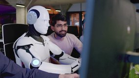 Side-view close-up portrait of white artificial intelligence robot working in office doing tasks with people. Futuristic cyborg typing on keyboard using computer. Workers watching bot working. - Powered by Shutterstock - Get 15% off with code: PIKWIZARD15