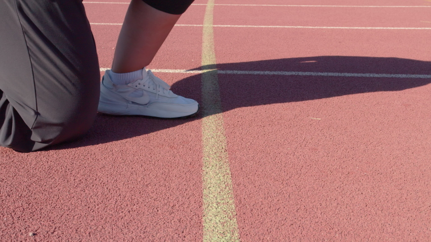 fat woman trying to lose weight by running, overweight woman getting ready to start. Mersin, Turkey - July 25 2022