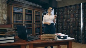 Female librarian is carrying out a video class