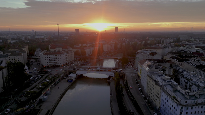 Sunrise over Vienna sklyine Austria city, vienna sunset downtown river bridge view.