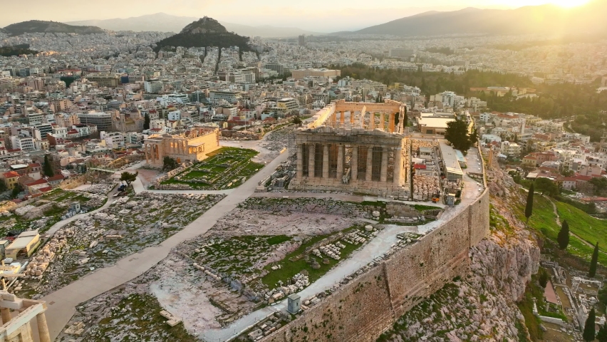 Sunrise at the Acropolis in Athens, Greek landmark aerial view, iconic antique ancient monument in Greece, capital of Greece skyline in golden light.  Royalty-Free Stock Footage #1097842715