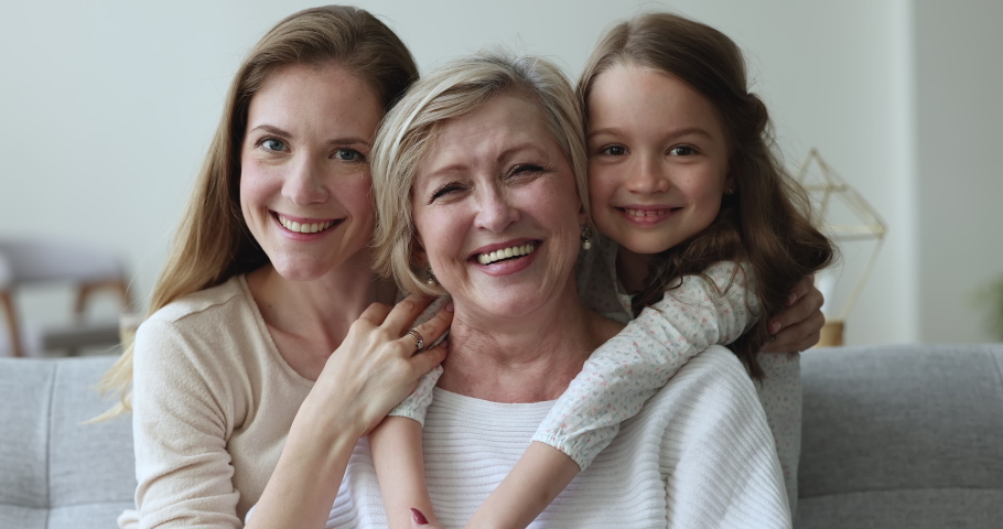 Older granny enjoy embraces and time with loving grown up daughter and granddaughter, close up view. Portrait of overjoyed multi generational family, understanding, harmonic relations, ties, affection Royalty-Free Stock Footage #1097845001