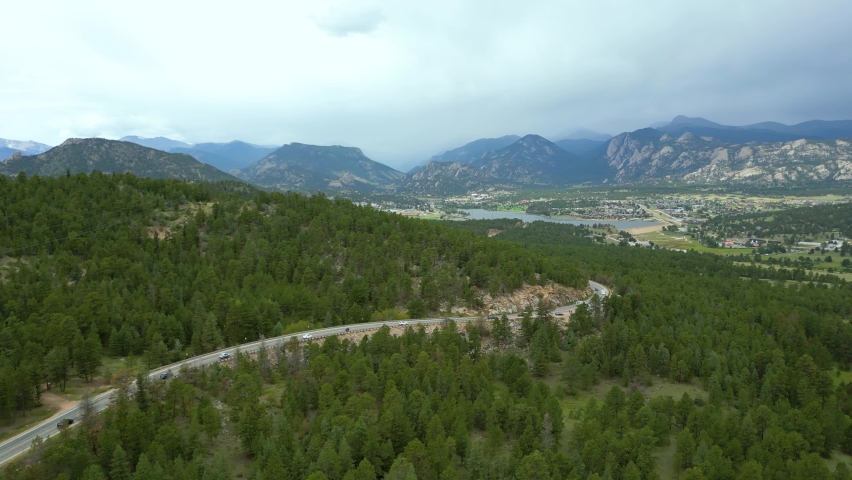 Aerial View Of Asphalt Road Through Pine Forest In Estes Park, Colorado, USA.