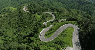 aerial view ROAD No.1081 beautiful curve winding mountain road between Pua District,Nan Province, Northern of Thailand 4k video from drone camera,