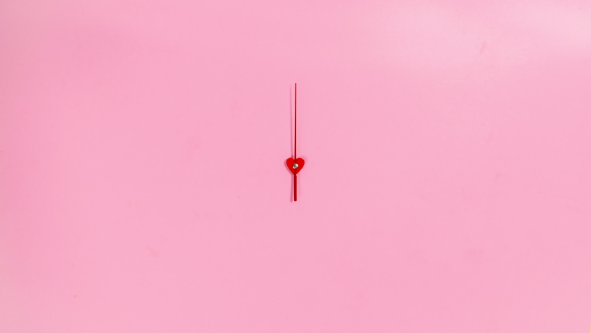4k The red hand of the clock rotates in a circle. Pink background. The concept of the transience of time. Heart in the center. Stop motion animation. Copy space. Flat lay. Royalty-Free Stock Footage #1097873917