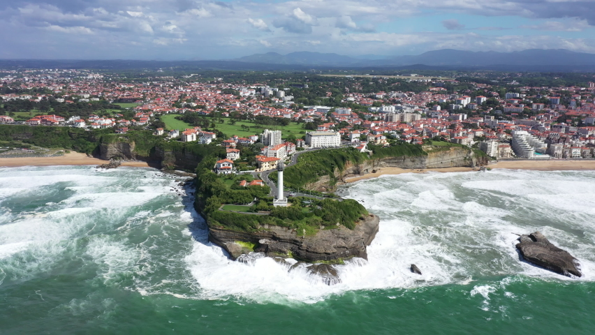 Beautiful Biarritz lighthouse surf destination aerial shot sunny day Royalty-Free Stock Footage #1097875991