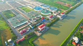 Drones are flying over water treatment plants, wastewater treatment ponds to remove chemicals and contaminants. tap water industry for consumption. pure drinking water concept. 4K
