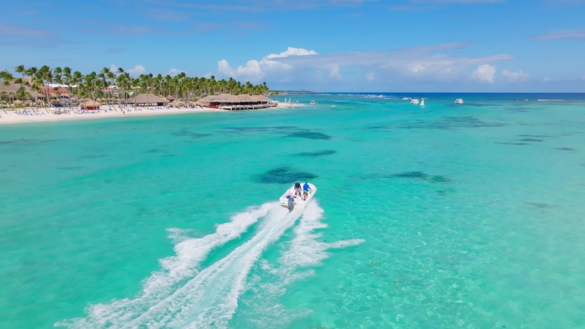 Speed Boat Across The Caribbean Sea Of Playa Blanca, Punta Cana Resort In Dominican Republic. Aerial Shot