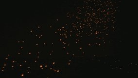 Drone flying through thousand sky lanterns in Yi-Peng festival Chiang Mai Thailand.