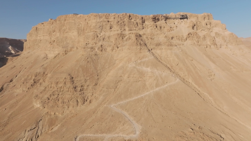 Masada National Park ,Israel table top summit, the snake trail aerial drone climb reveal shot 