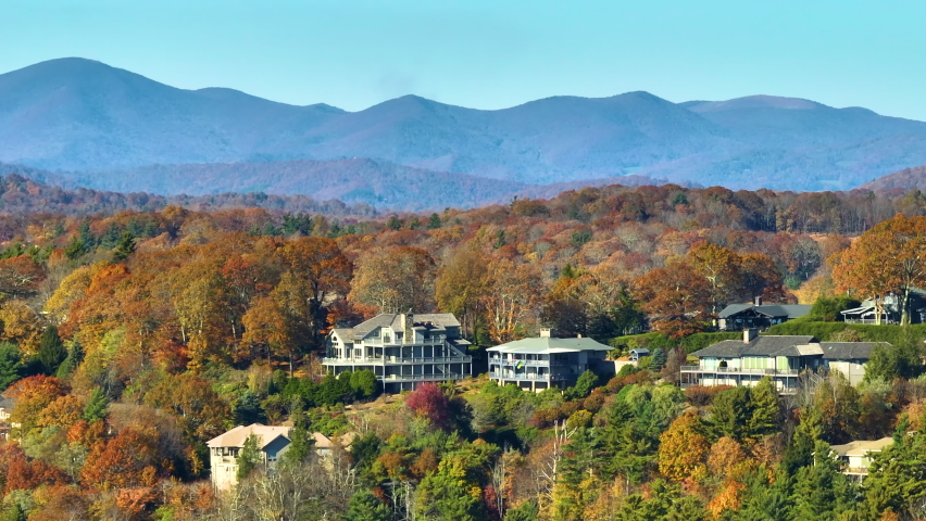 Aerial view of expensive american homes on hilltop in North Carolina mountains residential area. New family houses as example of real estate development in USA suburbs