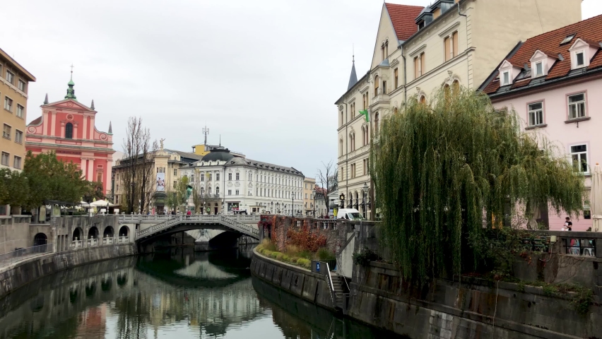 Center of Ljubljana in Slovenia among the typical streets and houses of the capital of Slovenia. Autumn in Slovenia. Trein in Slovenia. Royalty-Free Stock Footage #1097910083