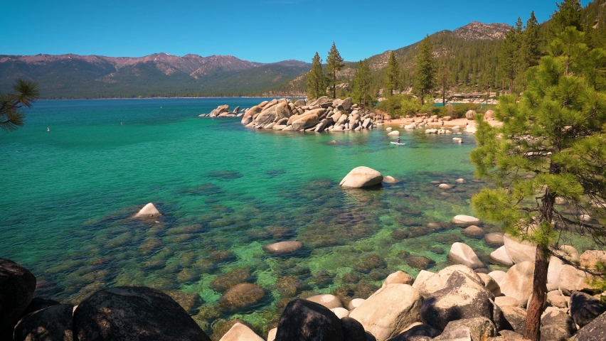 Canoe floating on the turquoise waters of Lake Tahoe in Sand Harbor Beach, Nevada, USA. 4K UHD video.