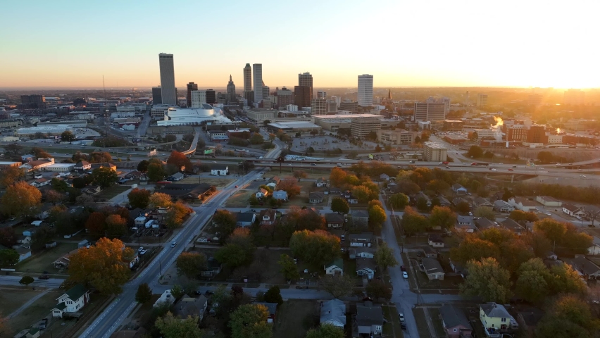 American city at sunrise. Morning golden hour in Tulsa Oklahoma. Neighborhood homes and houses in autumn.